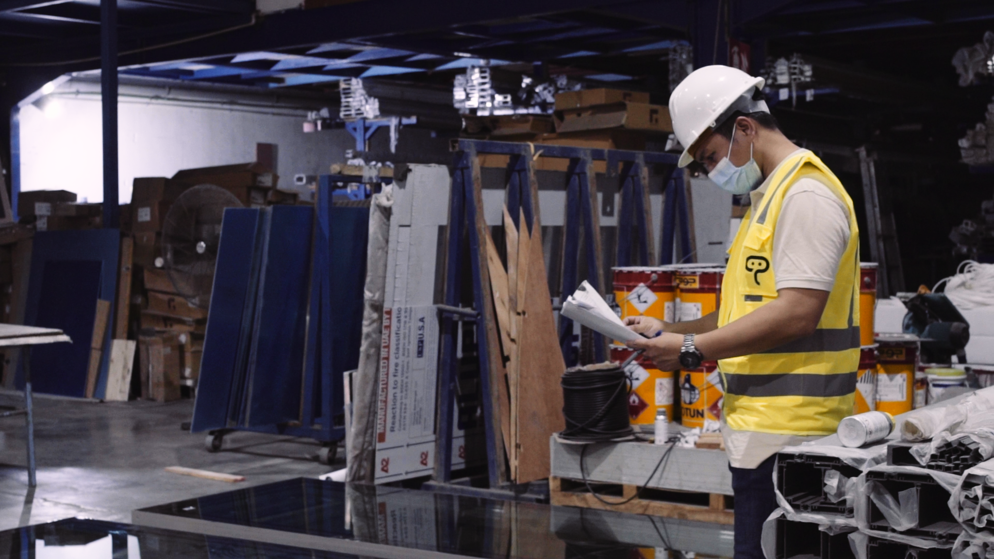 Production Process Improvement Factory inspector reviewing production processes